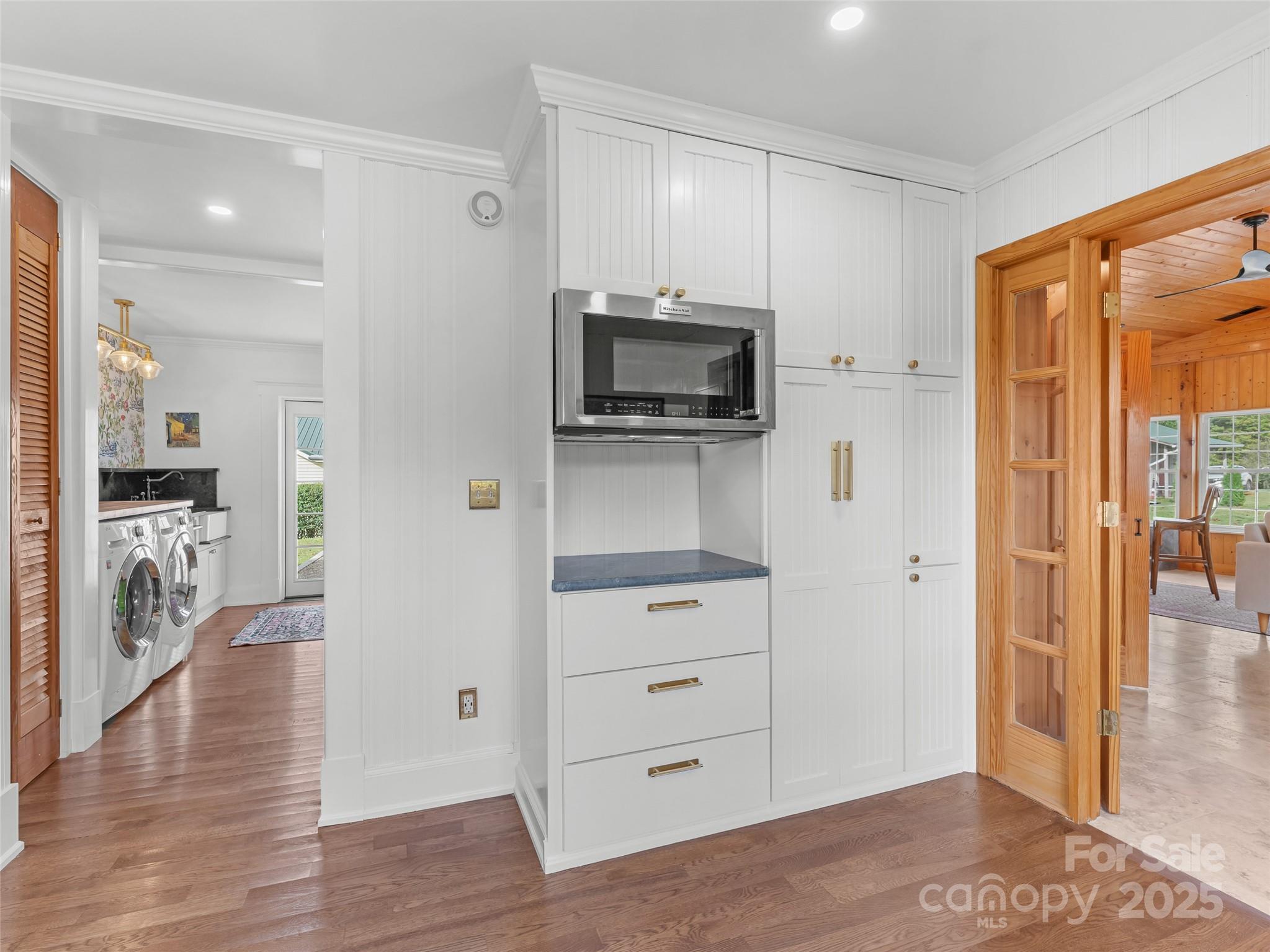 505 North Country Club Road Brevard, NC 28712 - Photo 19 of 48 a view of a hallway with wooden floor windows and a living room