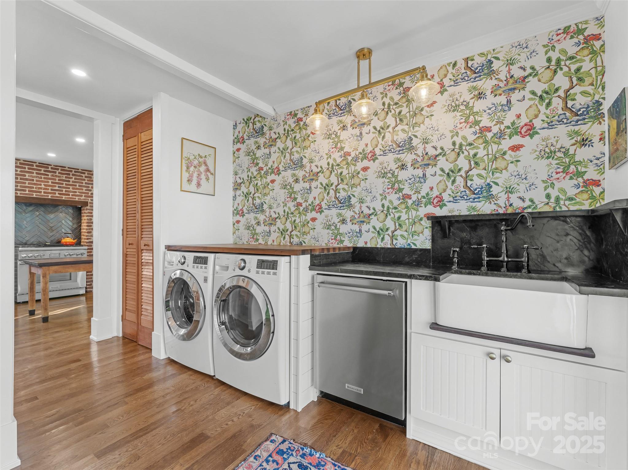 505 North Country Club Road Brevard, NC 28712 - Photo 21 of 48 a utility room with sink dryer and washer