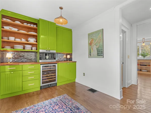 a kitchen with stainless steel appliances granite countertop a stove and a refrigerator