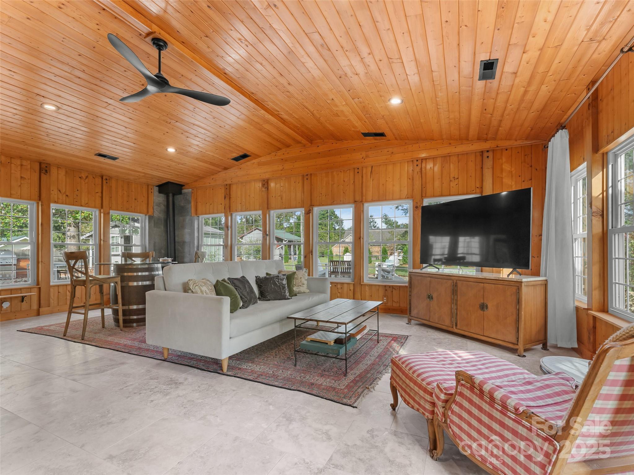 505 North Country Club Road Brevard, NC 28712 - Photo 26 of 48 a living room with furniture a flat screen tv and a large window