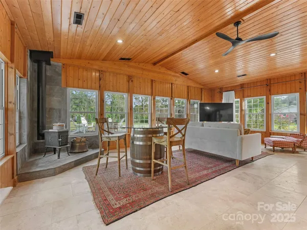 a room with wooden floor and windows