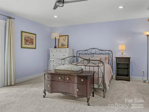 a living room with stainless steel appliances kitchen island granite countertop furniture and a wooden floor