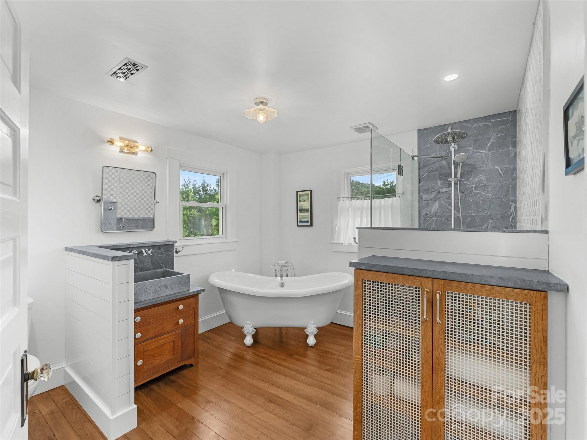 505 North Country Club Road Brevard, NC 28712 - Photo 32 of 48 a living room with stainless steel appliances kitchen island granite countertop furniture and a wooden floor