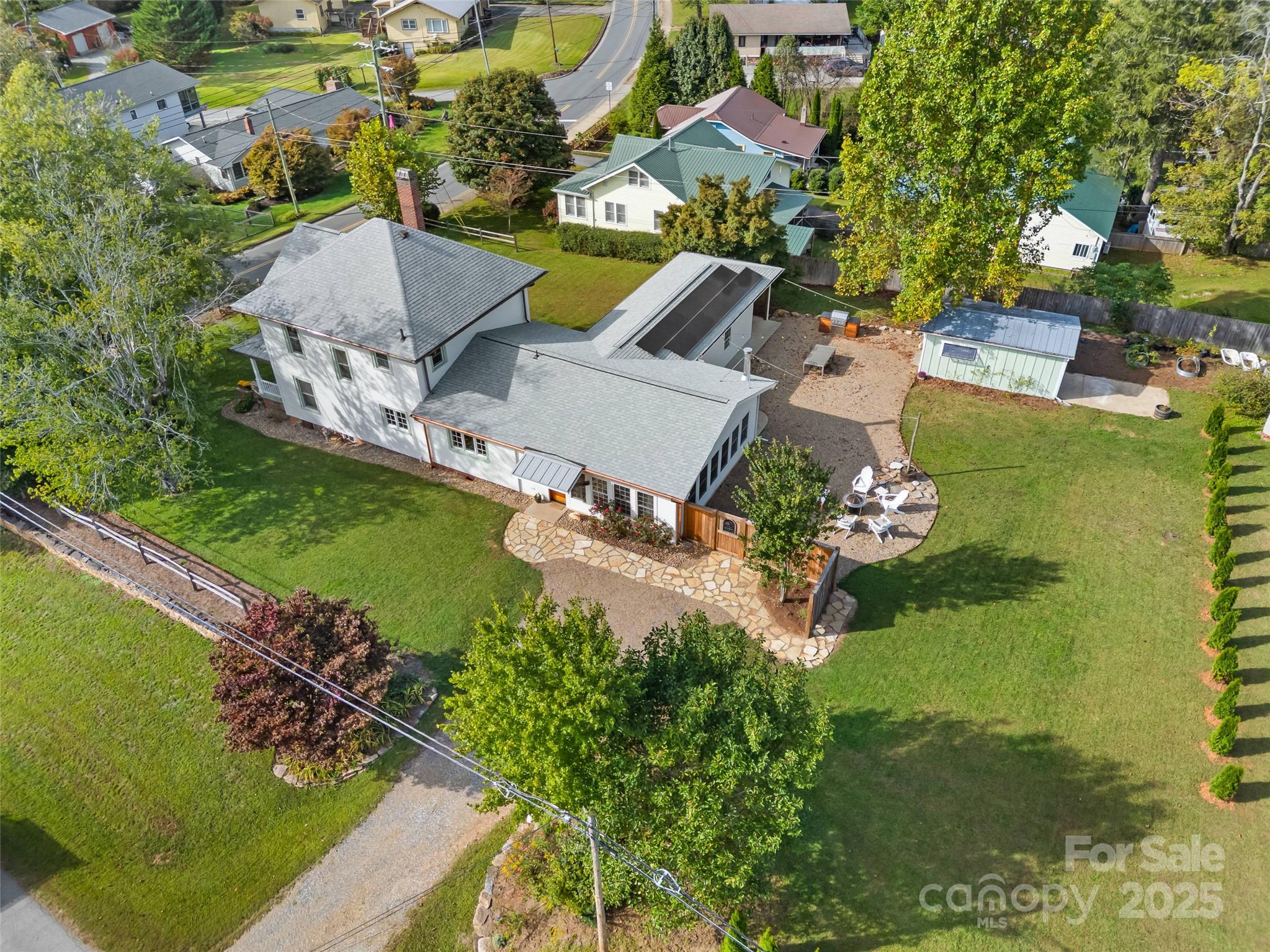 505 North Country Club Road Brevard, NC 28712 - Photo 40 of 48 an aerial view of a house with a garden and lake view