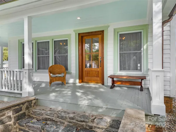 a view of a two chairs in the porch