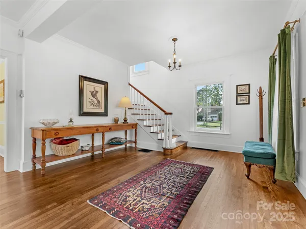a living room with furniture and a rug