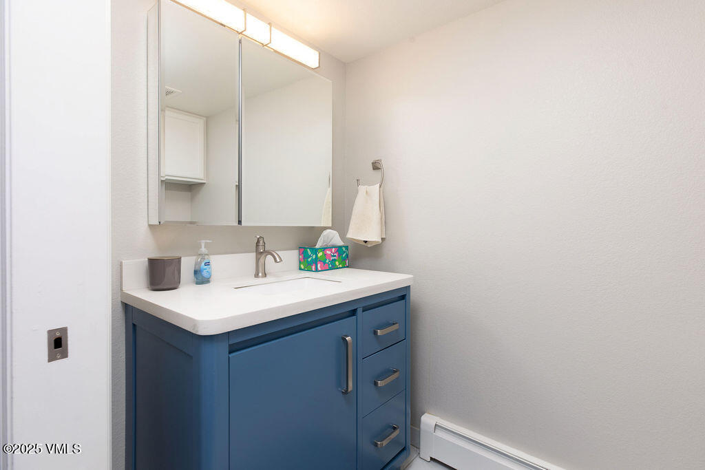 216 Main Street, Unit R316 Edwards, CO 81632 - Photo 12 of 12 a bathroom with a sink and a mirror