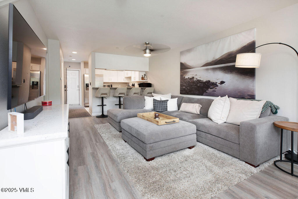 216 Main Street, Unit R316 Edwards, CO 81632 - Photo 3 of 12 a living room with furniture and a flat screen tv