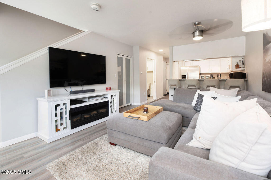216 Main Street, Unit R316 Edwards, CO 81632 - Photo 4 of 12 a living room with furniture and a flat screen tv