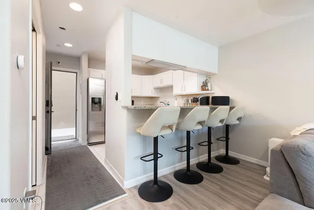 a view of livingroom and dining room with furniture