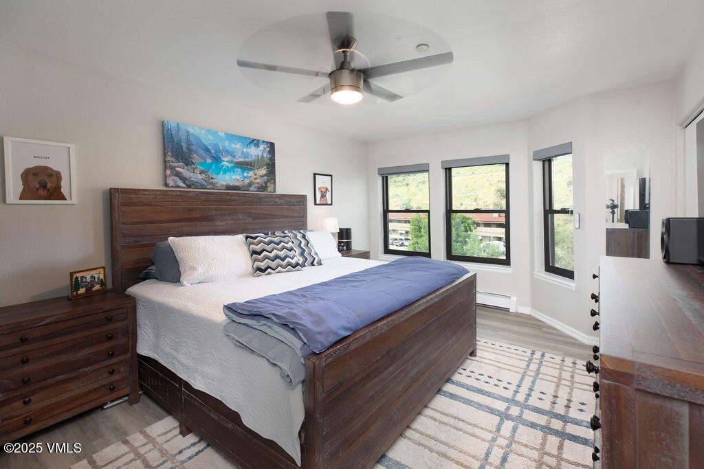 216 Main Street, Unit R316 Edwards, CO 81632 - Photo 8 of 12 a bedroom with a large bed and a window