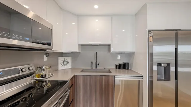 a dining room with furniture and a large window