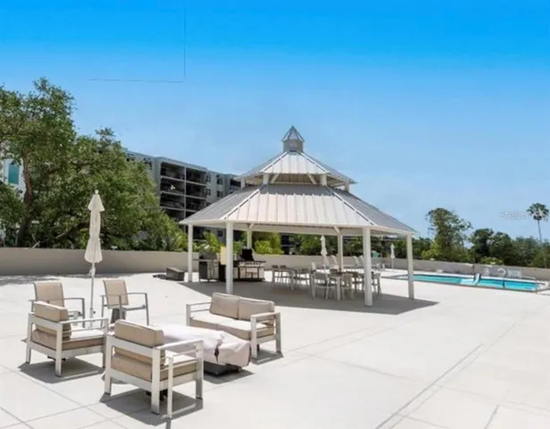 a front view of residential houses with yard and trees