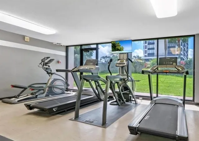 a view of a balcony with table and chairs