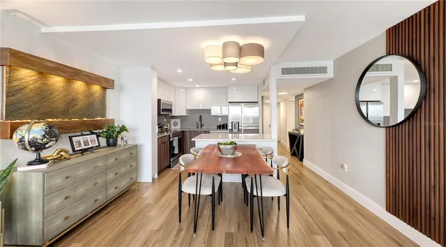 a kitchen with a table and chairs in it