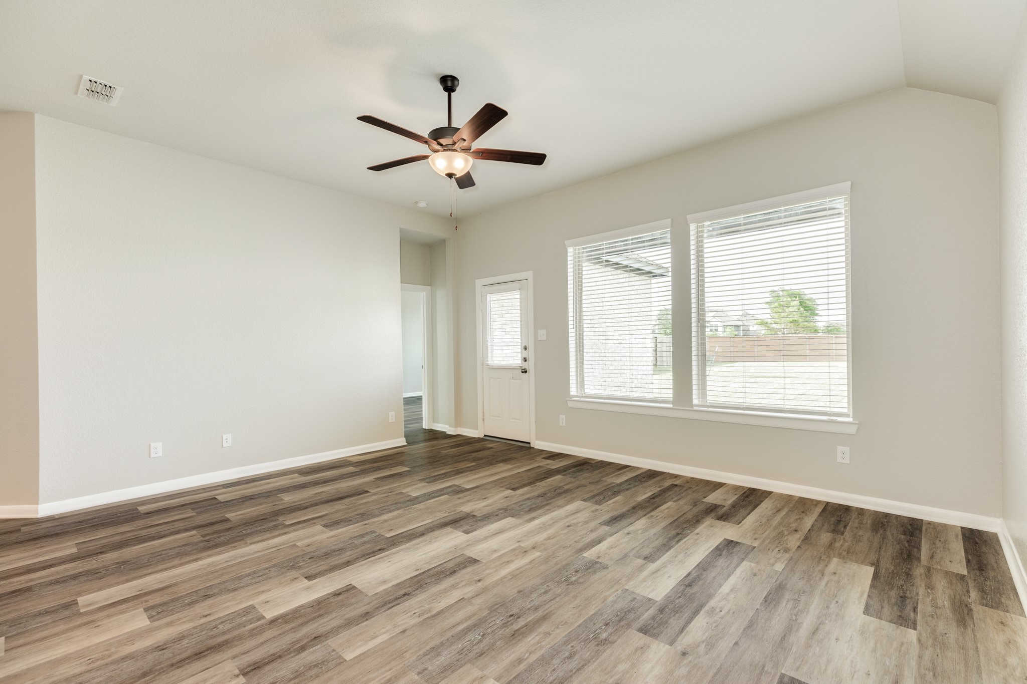 4946 Hitchings Court Rosharon, TX 77583 - Photo 17 of 49 The family area is spacious, with oversized windows overlooking the covered patio and backyard.