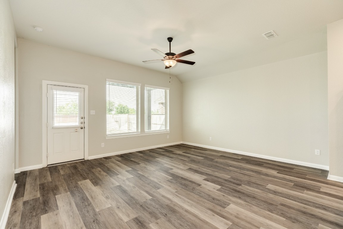 4946 Hitchings Court Rosharon, TX 77583 - Photo 18 of 49 This view captures the backdoor, providing access to the covered patio and expansive backyard.