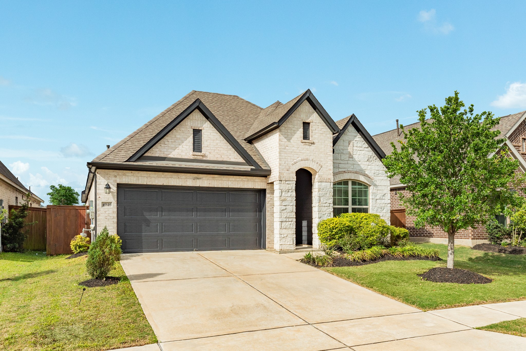 4946 Hitchings Court Rosharon, TX 77583 - Photo 33 of 49 This aerial view displays the double driveway, the attached double garage, and the well-manicured landscaping.
