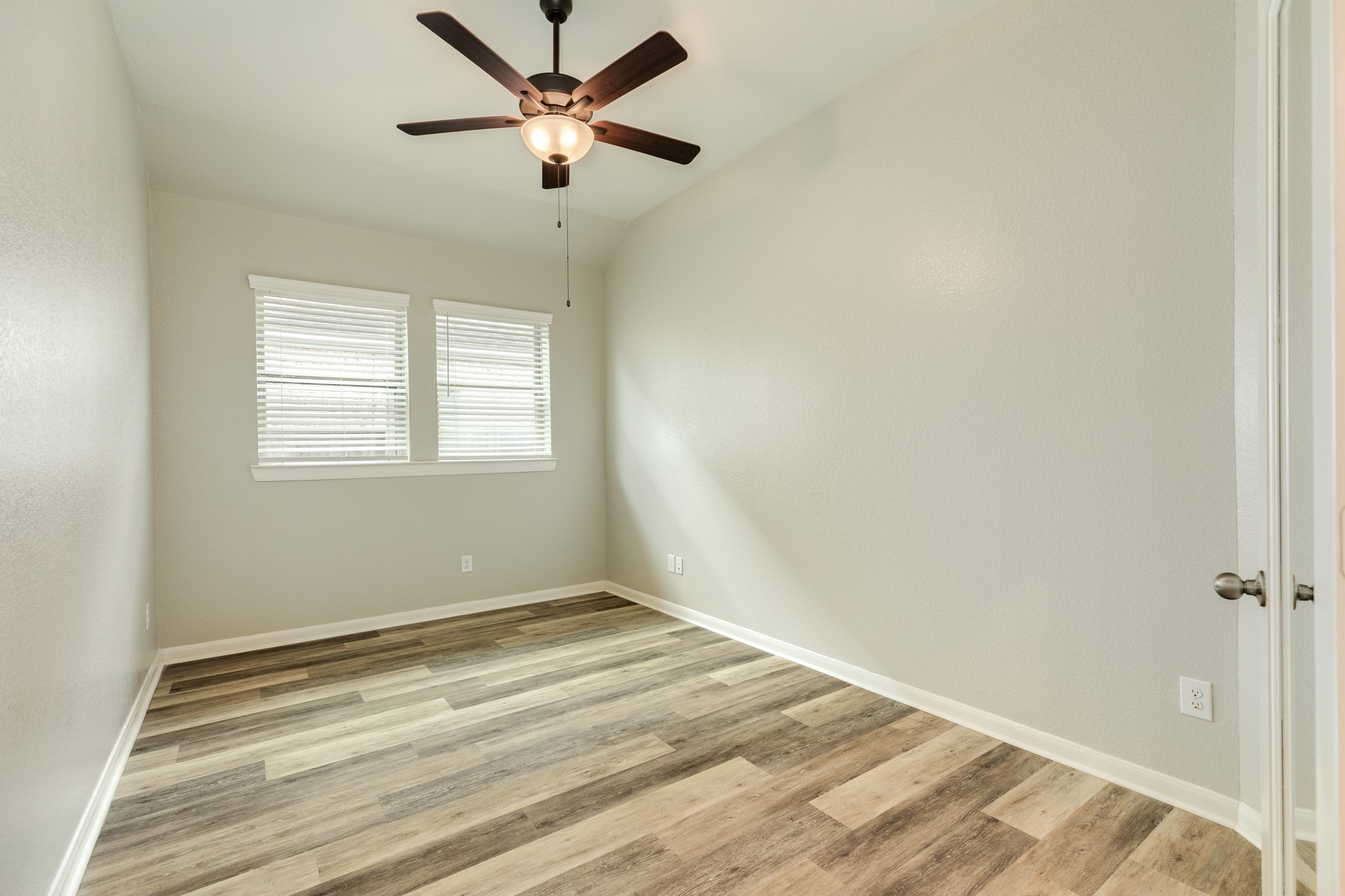 4946 Hitchings Court Rosharon, TX 77583 - Photo 7 of 49 This view showcases the property through the double doors, complemented by two large windows that generously admit natural light.