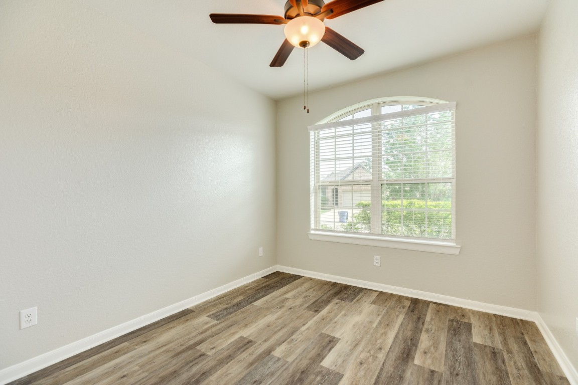 4946 Hitchings Court Rosharon, TX 77583 - Photo 8 of 49 Spacious secondary bedroom with a large closet, oversized windows, and front-facing view.