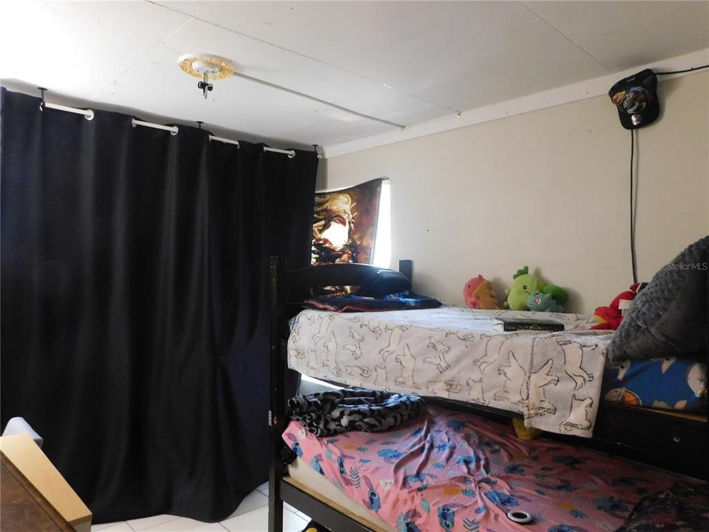 528 Briarwood Road Venice, FL 34293 - Photo 12 of 44 a bedroom with bed and window