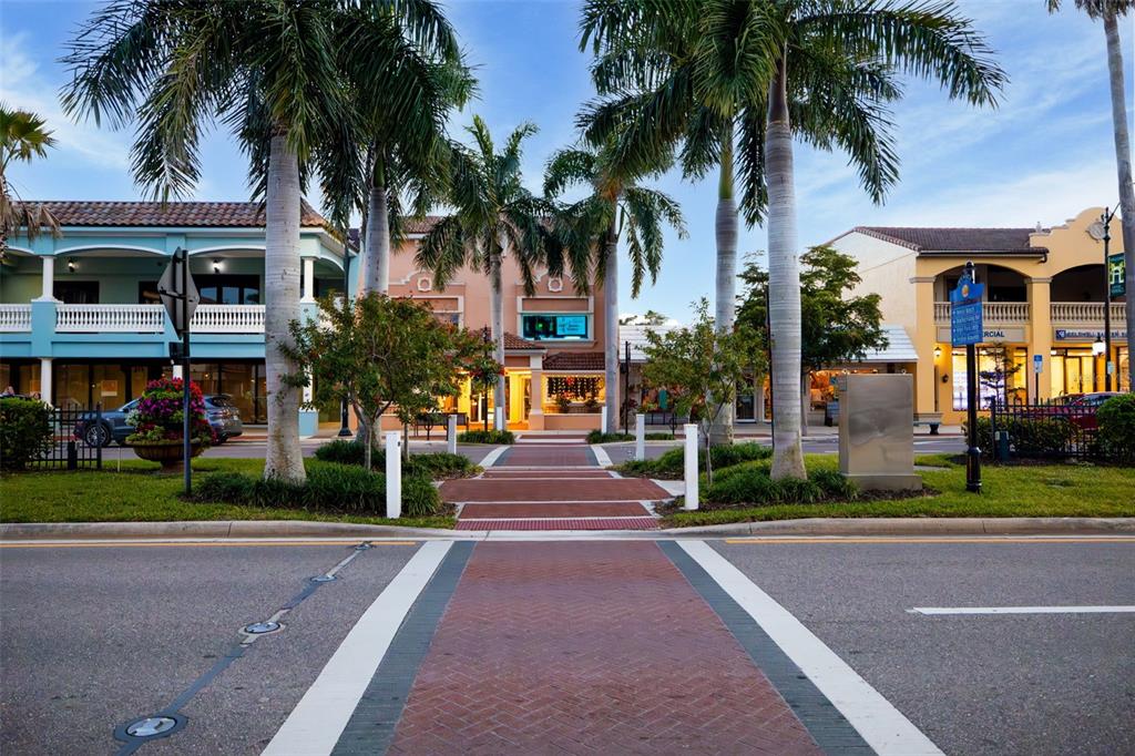 528 Briarwood Road Venice, FL 34293 - Photo 44 of 44 a front view of multiple houses with yard and green space