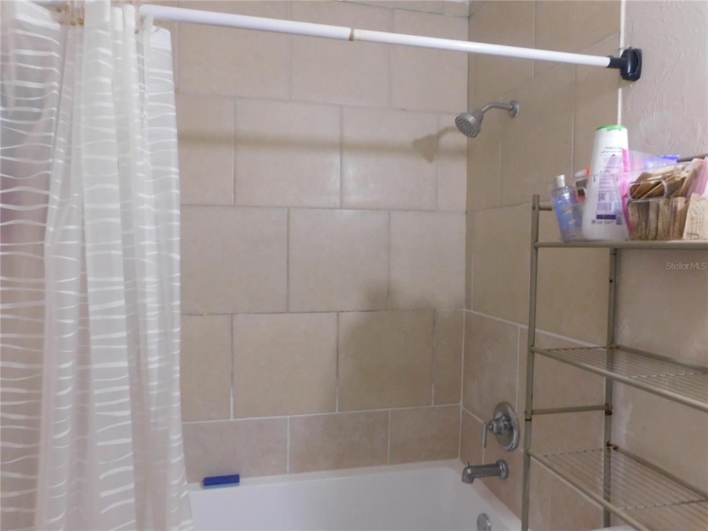 528 Briarwood Road Venice, FL 34293 - Photo 8 of 44 a bathroom with a shower