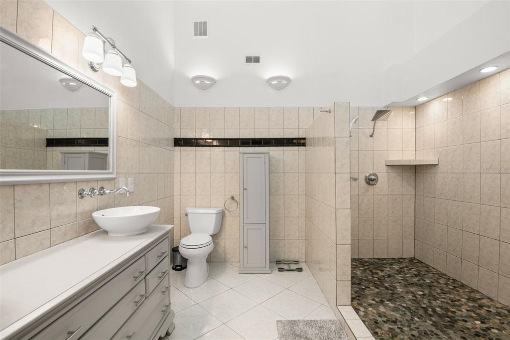 529 Sandy Hook Road Treasure Island, FL 33706 - Photo 29 of 55 a bathroom with a sink a toilet and shower