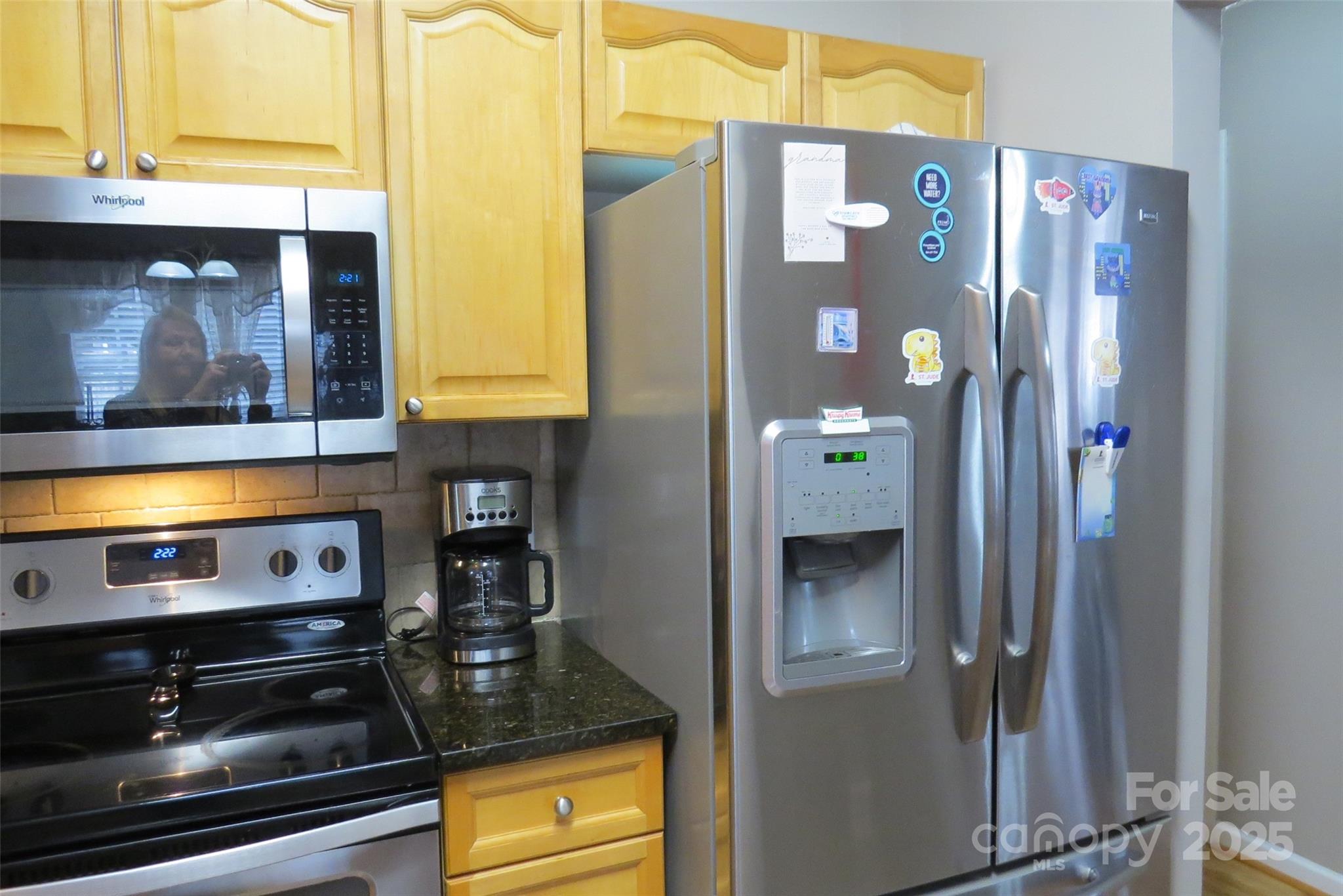 2901 Compton Court Northwest Concord, NC 28027 - Photo 13 of 35 a kitchen with a refrigerator and cabinets