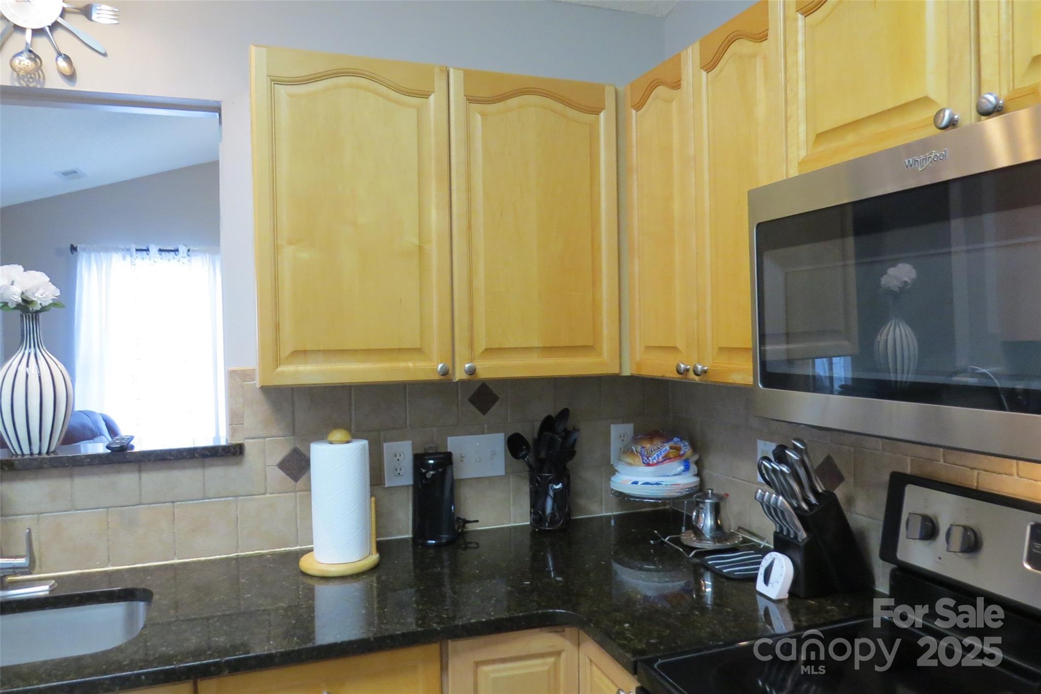 2901 Compton Court Northwest Concord, NC 28027 - Photo 15 of 35 a kitchen with a sink a stove and a microwave