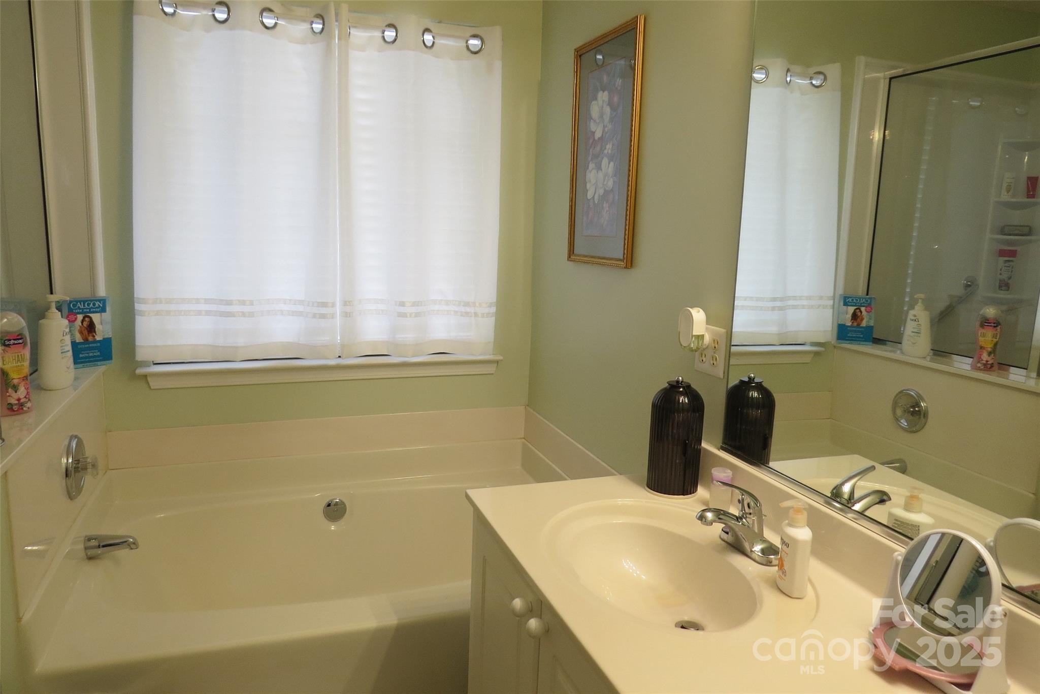 2901 Compton Court Northwest Concord, NC 28027 - Photo 24 of 35 a bathroom with a sink and a mirror