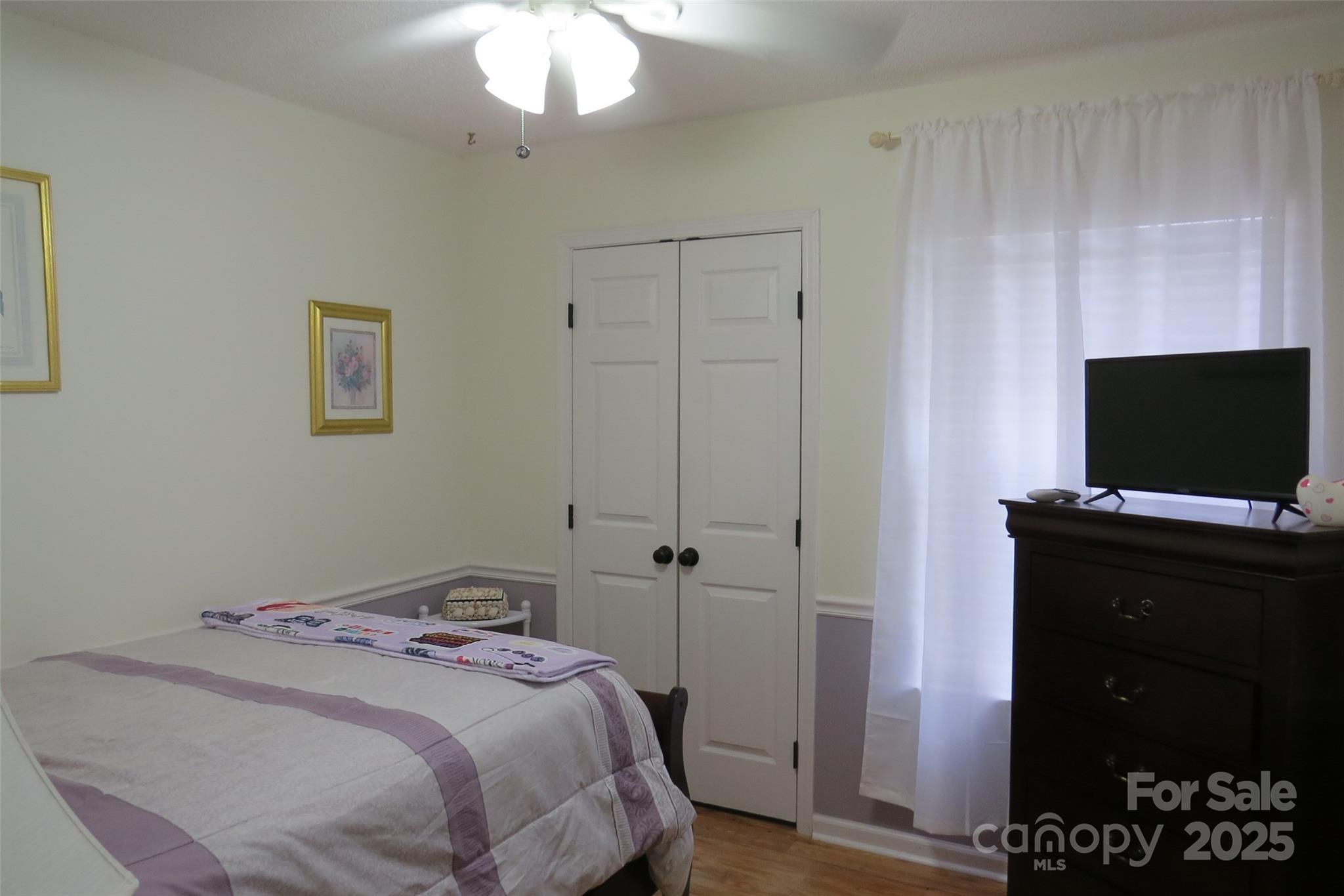 2901 Compton Court Northwest Concord, NC 28027 - Photo 26 of 35 a bedroom with a bed and a flat screen tv