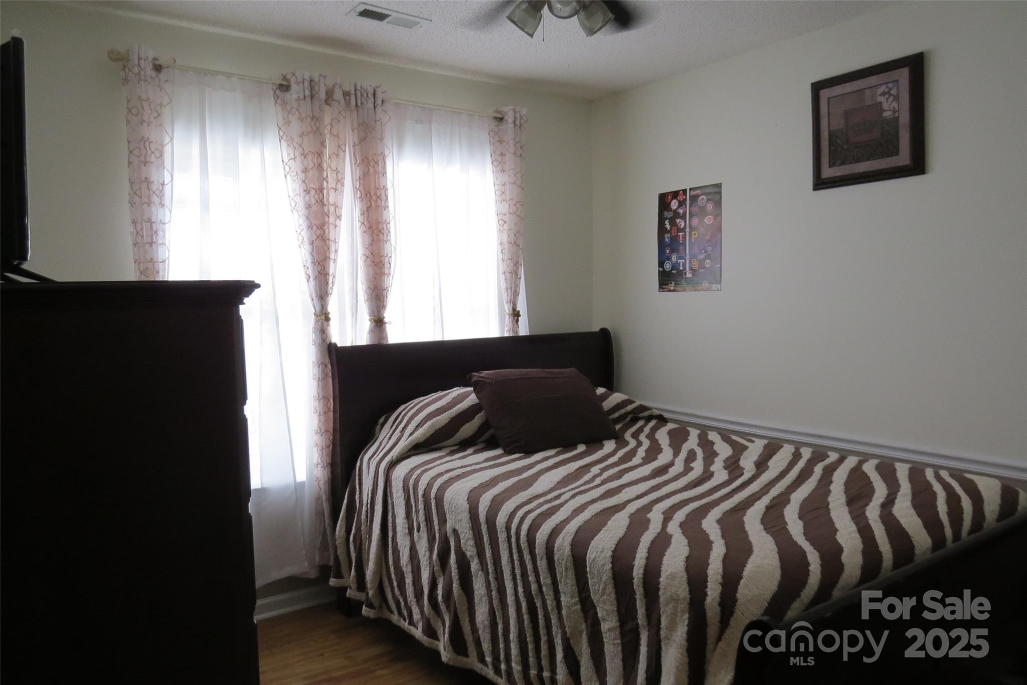 2901 Compton Court Northwest Concord, NC 28027 - Photo 27 of 35 a bedroom with a bed and a window