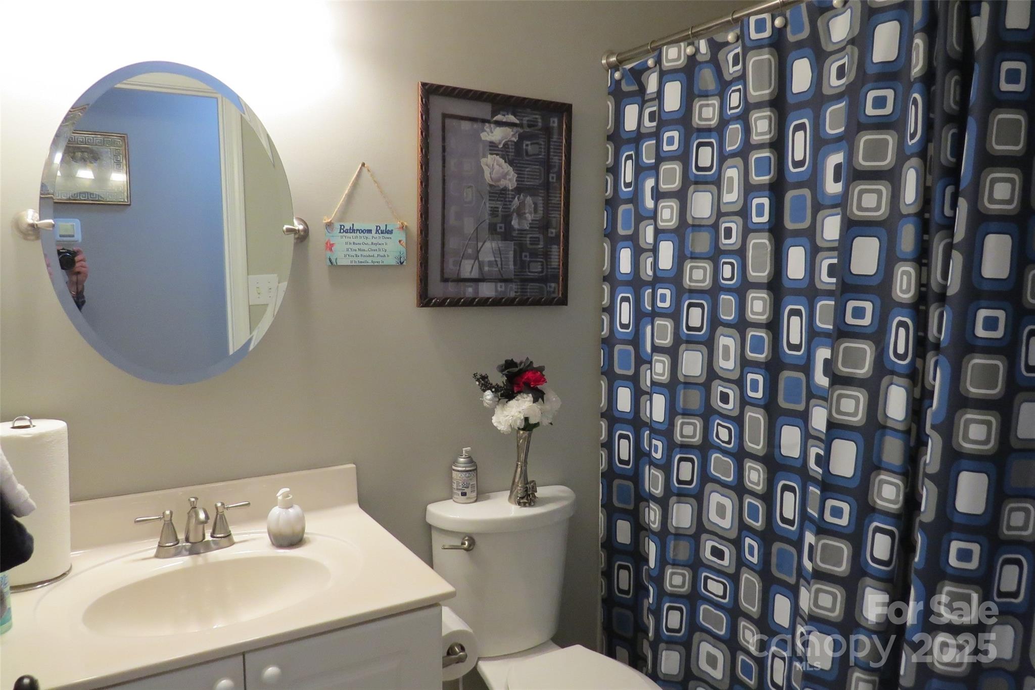2901 Compton Court Northwest Concord, NC 28027 - Photo 28 of 35 a bathroom with a sink toilet and mirror