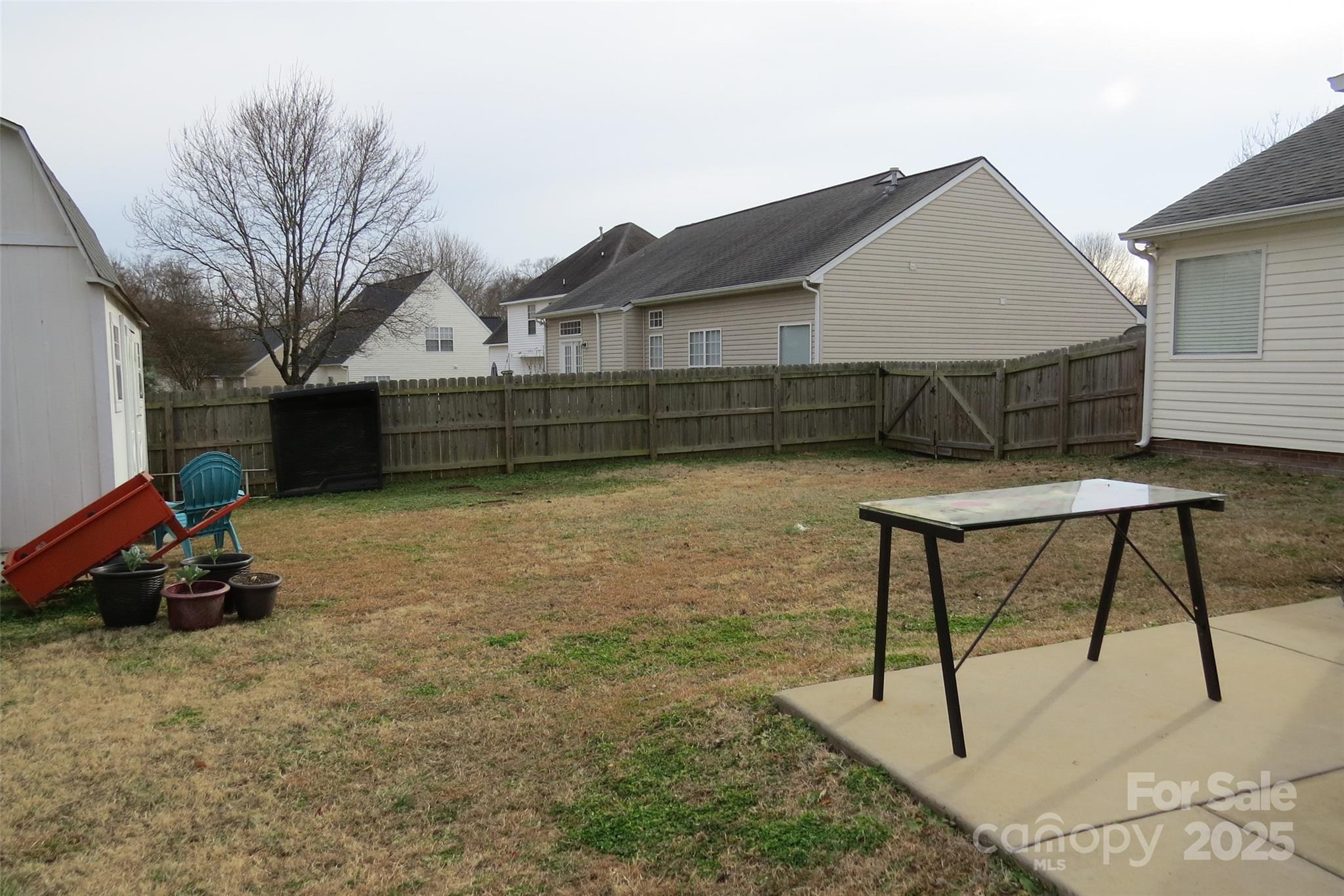 2901 Compton Court Northwest Concord, NC 28027 - Photo 30 of 35 a backyard of a house with table and chairs