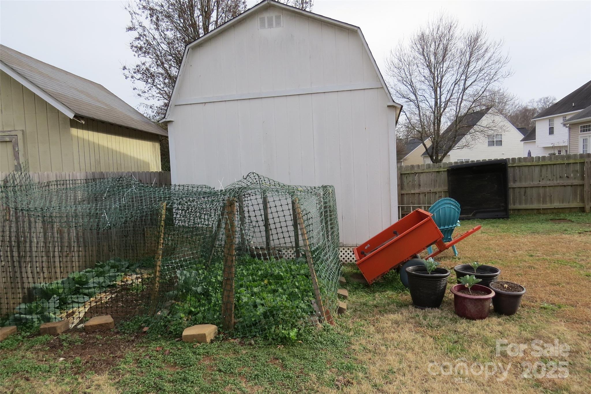 2901 Compton Court Northwest Concord, NC 28027 - Photo 34 of 35 a view of a terrace with chairs and a fire pit