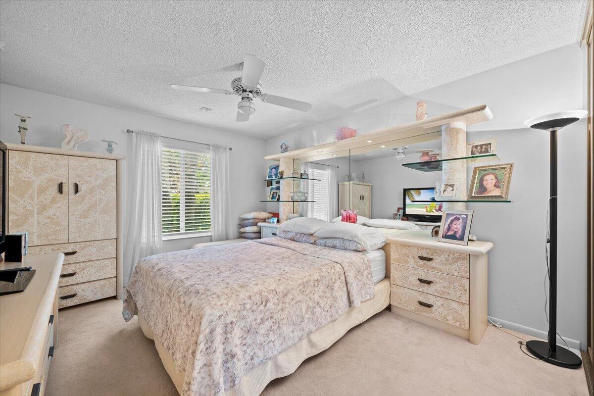 352 River Edge Road Jupiter, FL 33477 - Photo 22 of 56 a bed room with a bed and a window