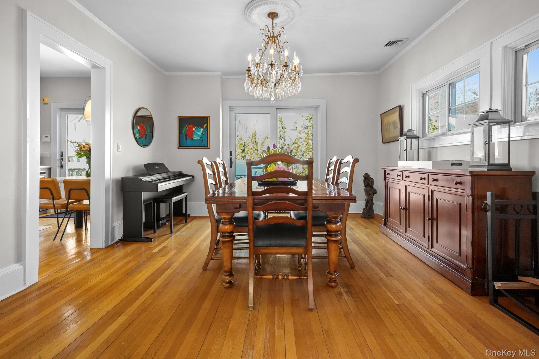 181 Webster Road Scarsdale, NY 10583 - Photo 13 of 30 a view of a dining room with furniture window and wooden floor