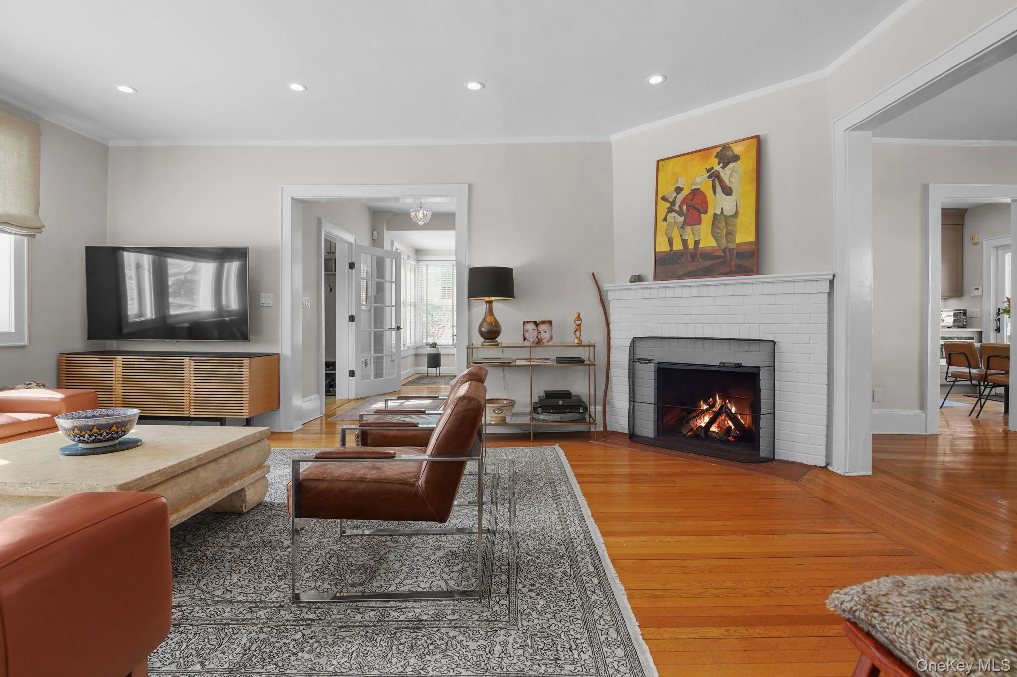 181 Webster Road Scarsdale, NY 10583 - Photo 14 of 30 a living room with furniture and a fireplace