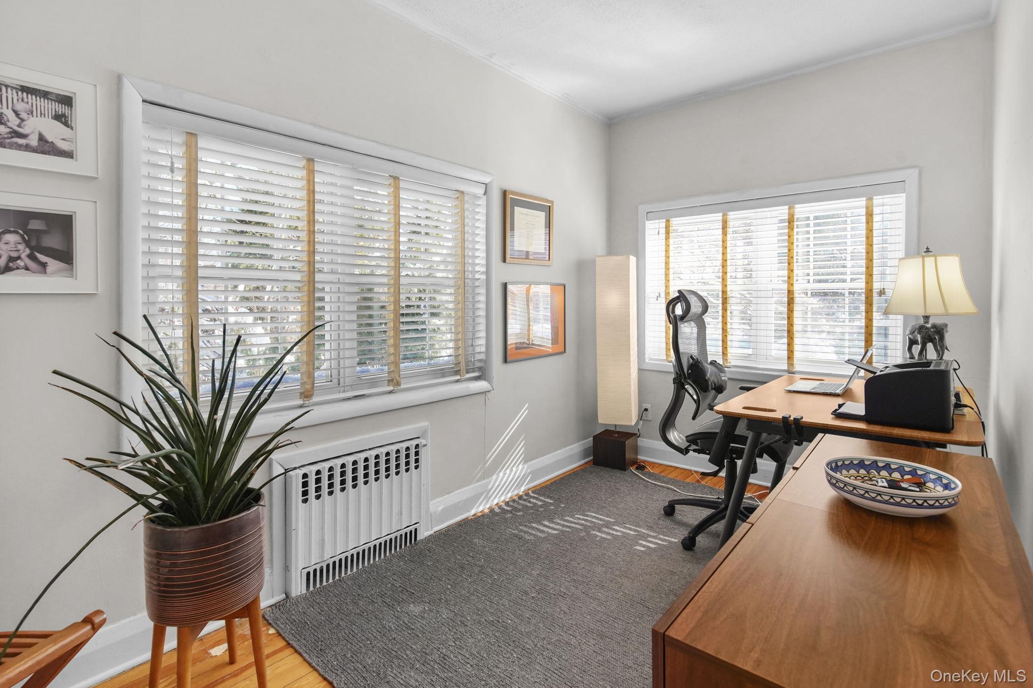 181 Webster Road Scarsdale, NY 10583 - Photo 16 of 30 a view of a workspace with furniture and a window