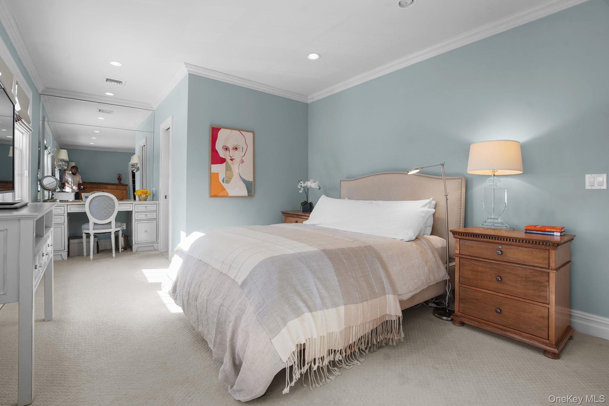 181 Webster Road Scarsdale, NY 10583 - Photo 18 of 30 a spacious bedroom with a bed and a lamp