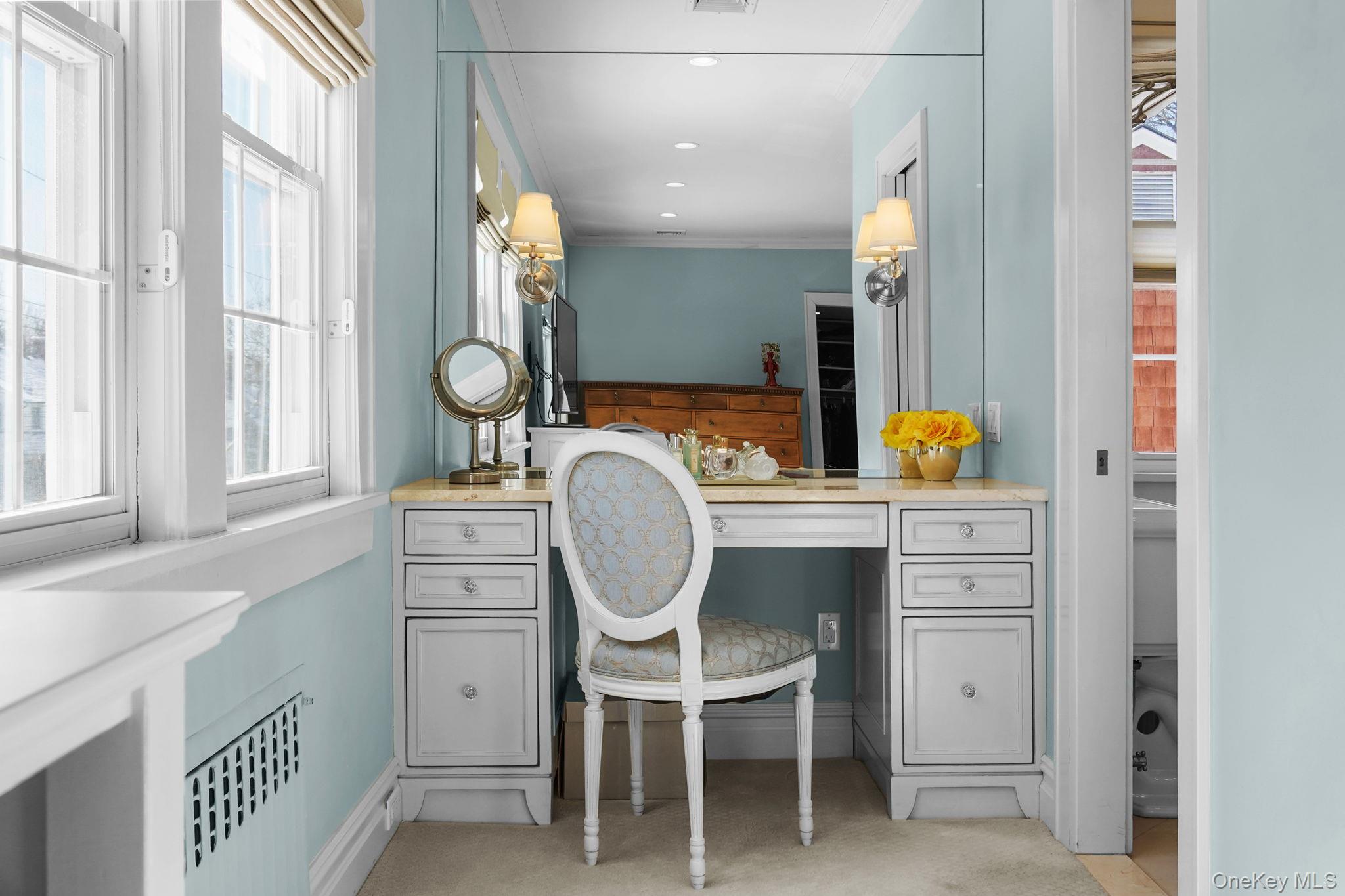 181 Webster Road Scarsdale, NY 10583 - Photo 19 of 30 a bathroom with a sink mirror vanity and a window