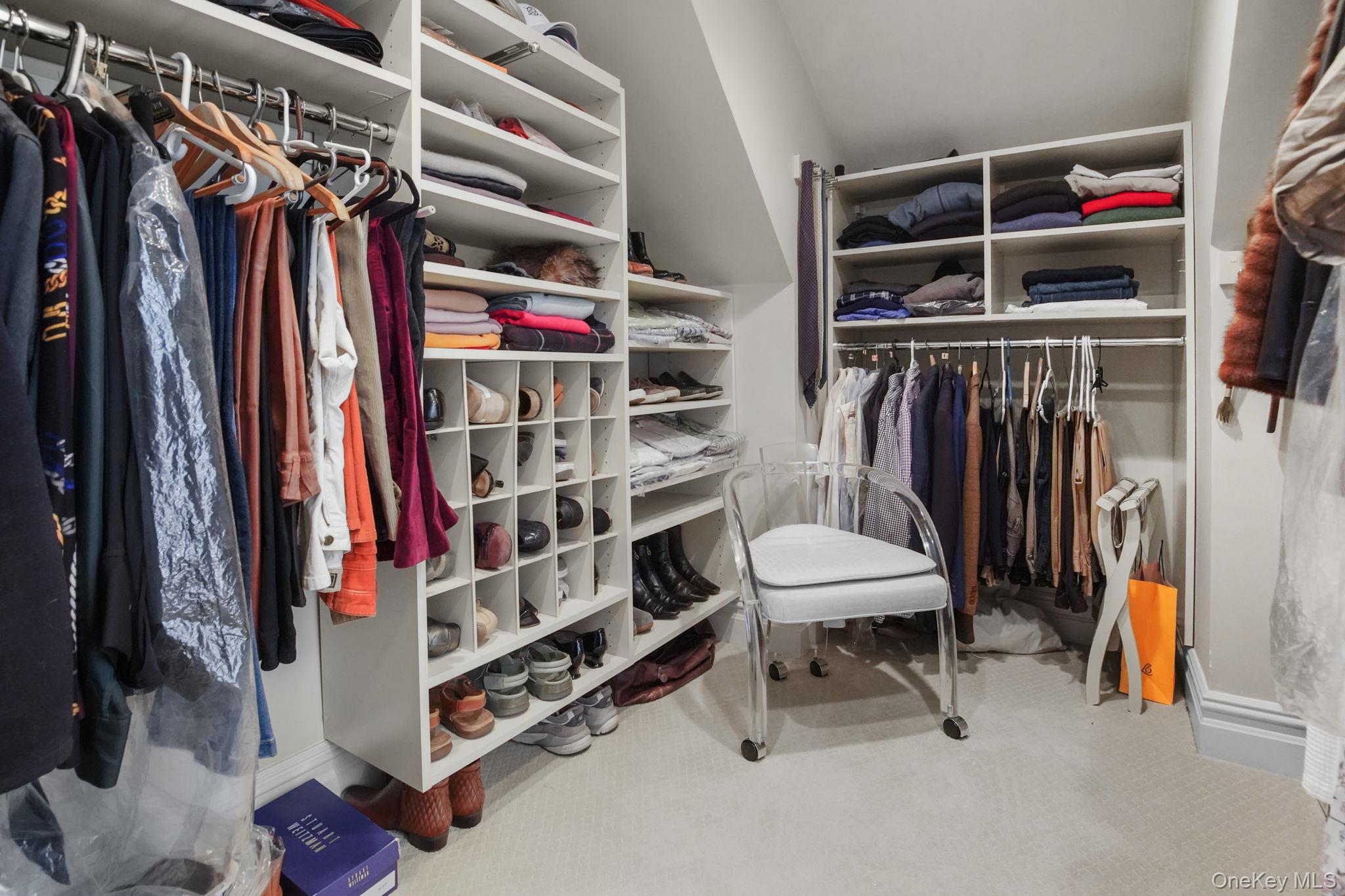 181 Webster Road Scarsdale, NY 10583 - Photo 21 of 30 a view of walk in closet with clothes and shoes
