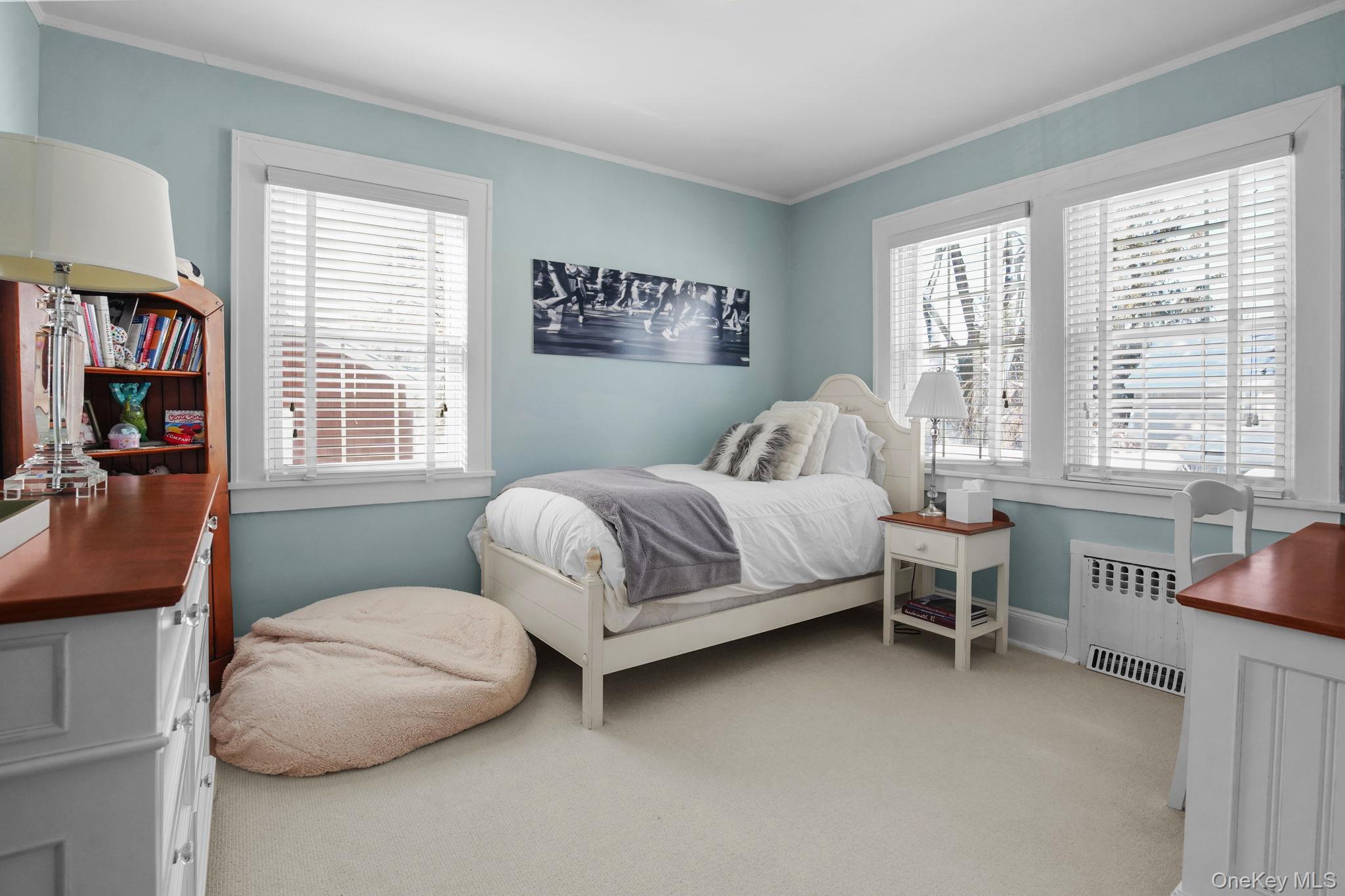 181 Webster Road Scarsdale, NY 10583 - Photo 24 of 30 a bedroom with a bed and a couch