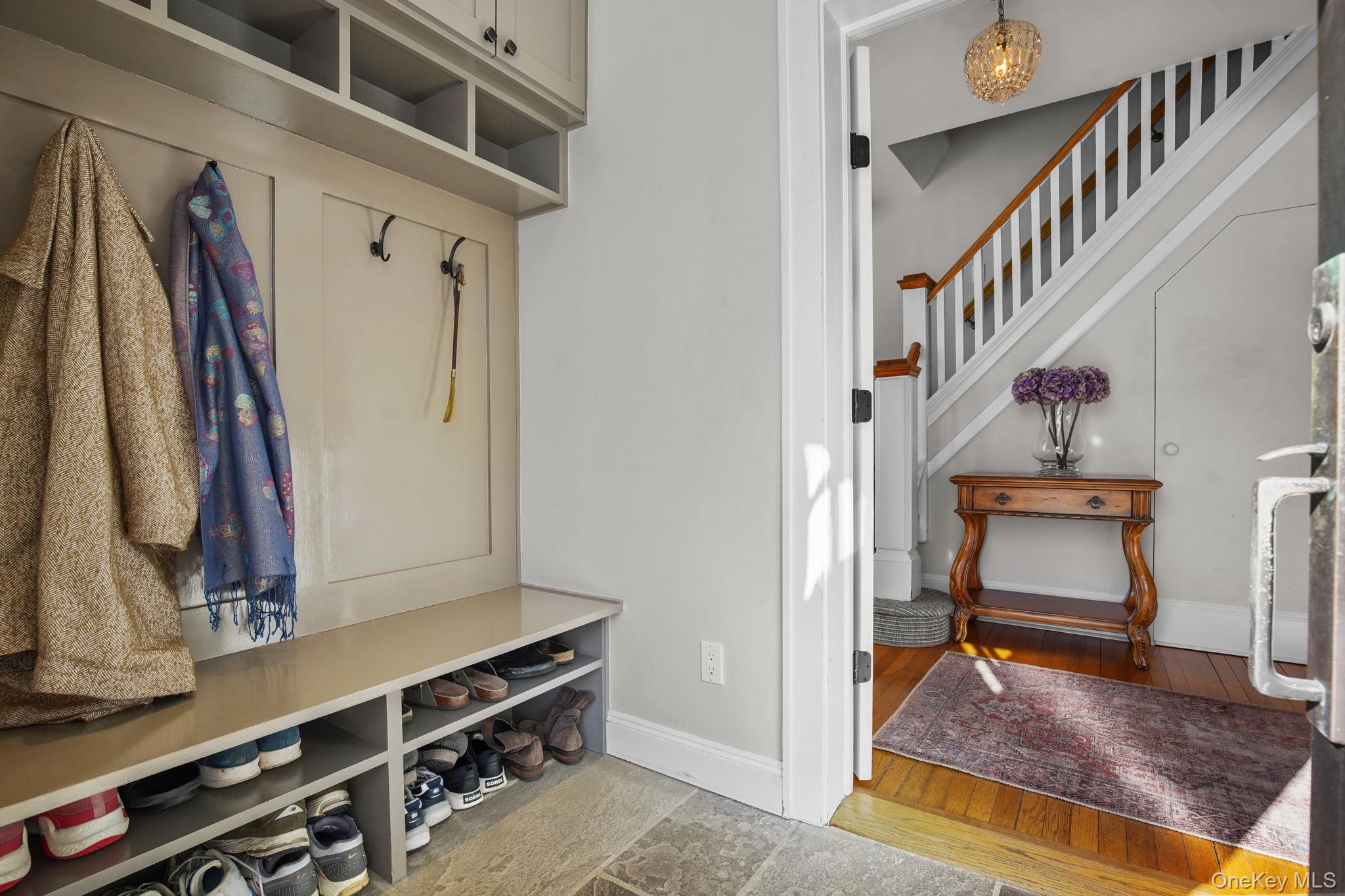 181 Webster Road Scarsdale, NY 10583 - Photo 4 of 30 a view of an entryway with wooden floor and a front door