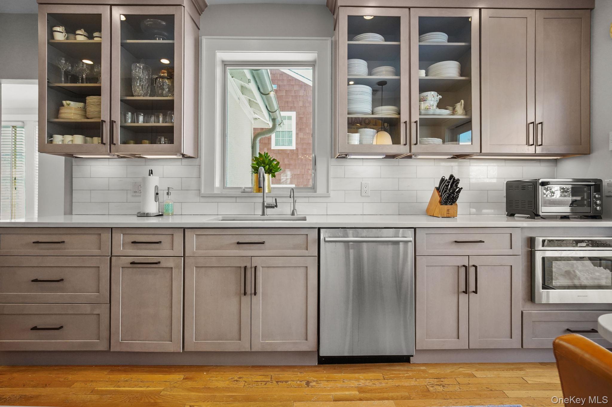 181 Webster Road Scarsdale, NY 10583 - Photo 10 of 30 a kitchen with cabinets appliances and a window