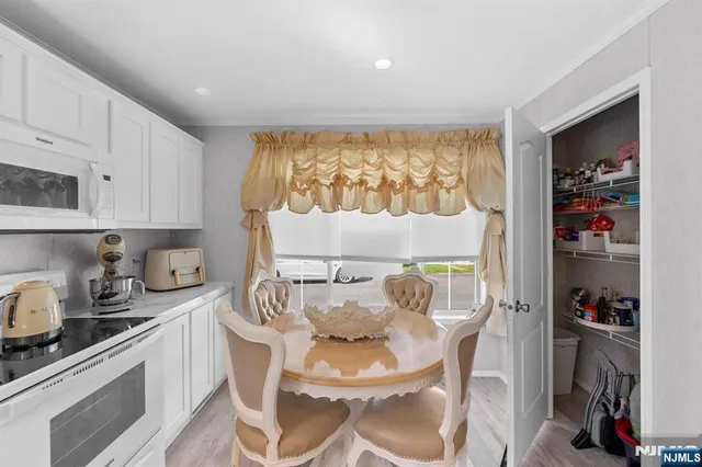 a kitchen with a table and chairs in it