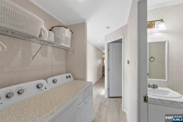 a bathroom with a tub sink and mirror