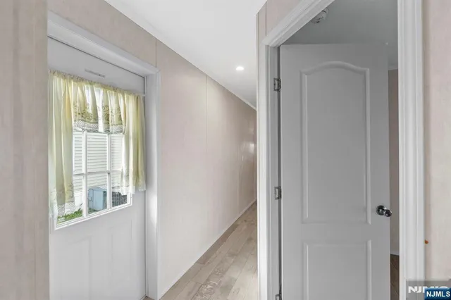 a view of a hallway with windows