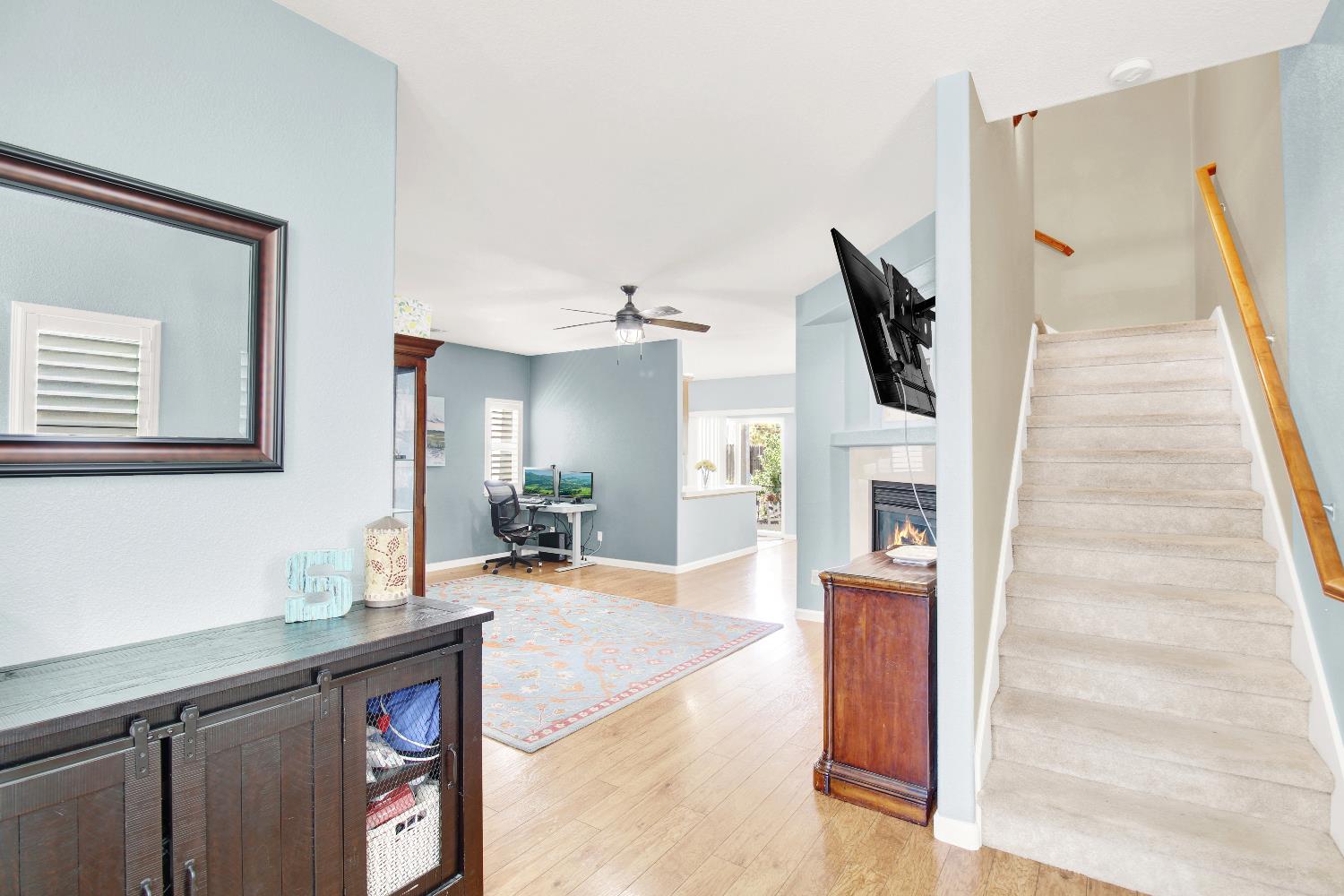 a view of a living room with furniture and a flat screen tv